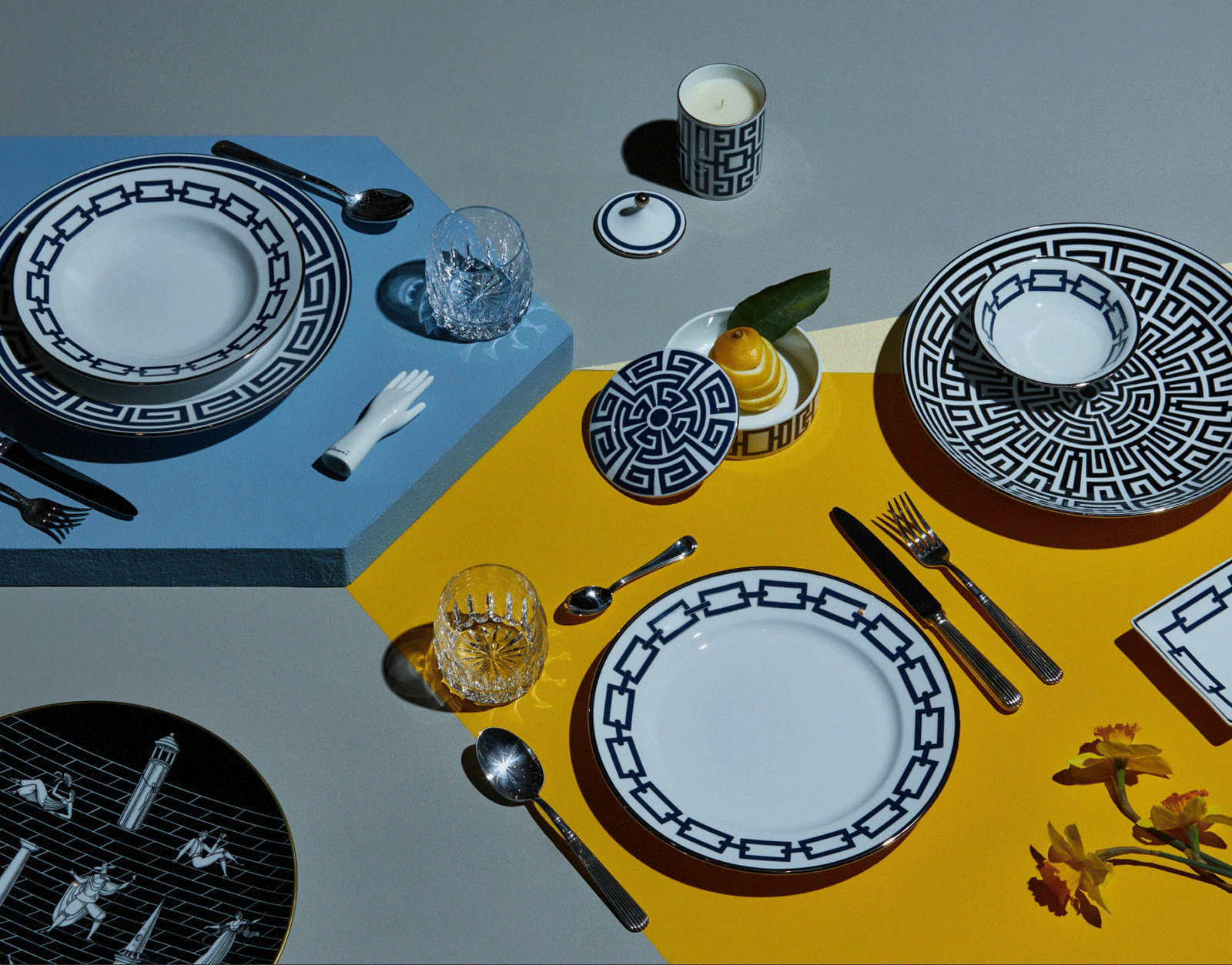 Ginori 1735 Labirinto plates and bowl on a blue and yellow table