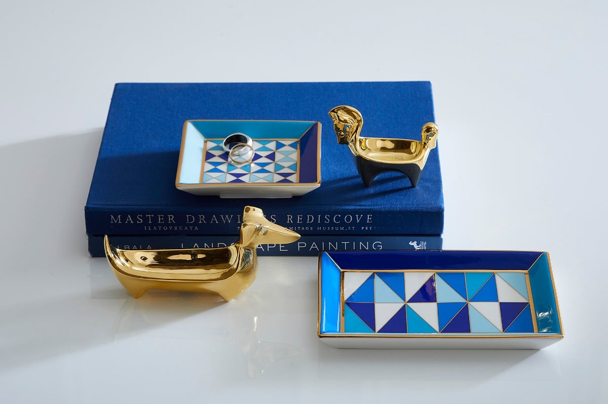 Jonathan Adler blue and gold trinket trays with brass animal figures