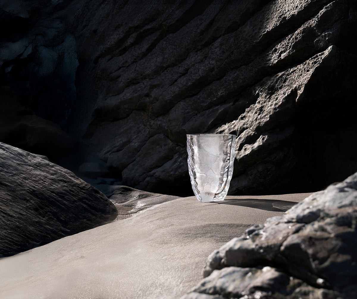 Lalique crystal vase on a rock by the water