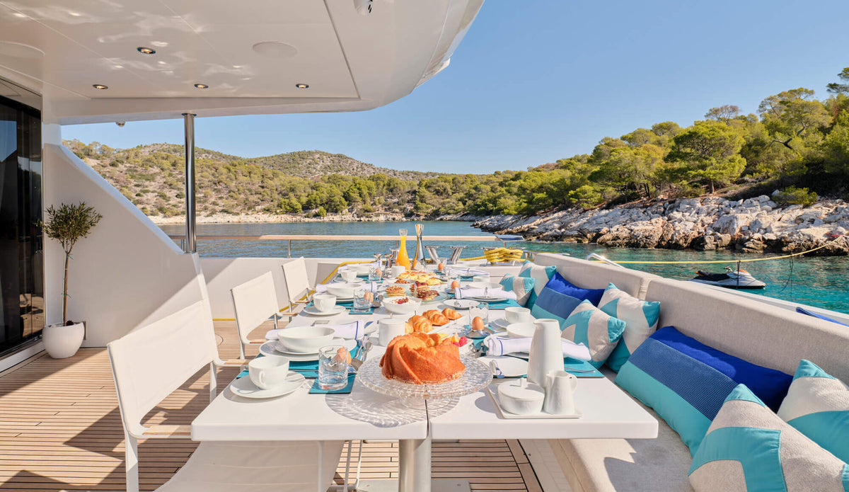 Table set for breakfast on a yacht deck