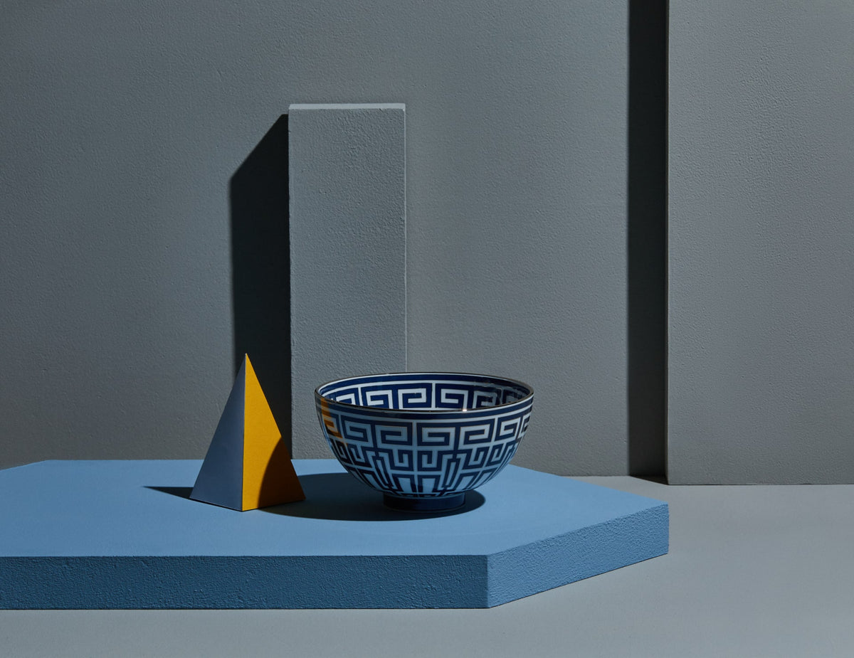 Ginori 1735 bowl with a Greek key pattern on a blue plinth