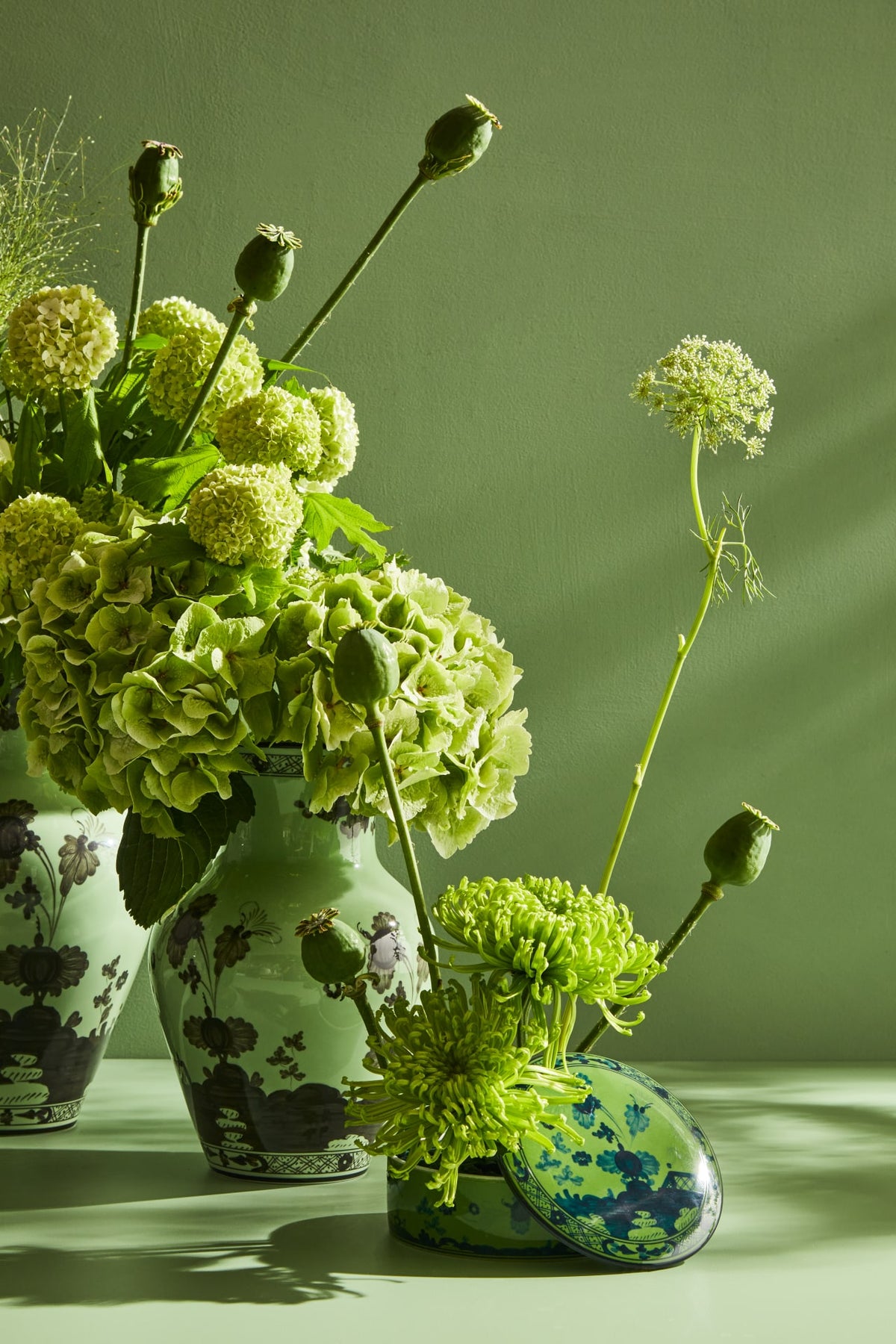 Ginori 1735 green porcelain vases with hydrangeas and poppy seed heads