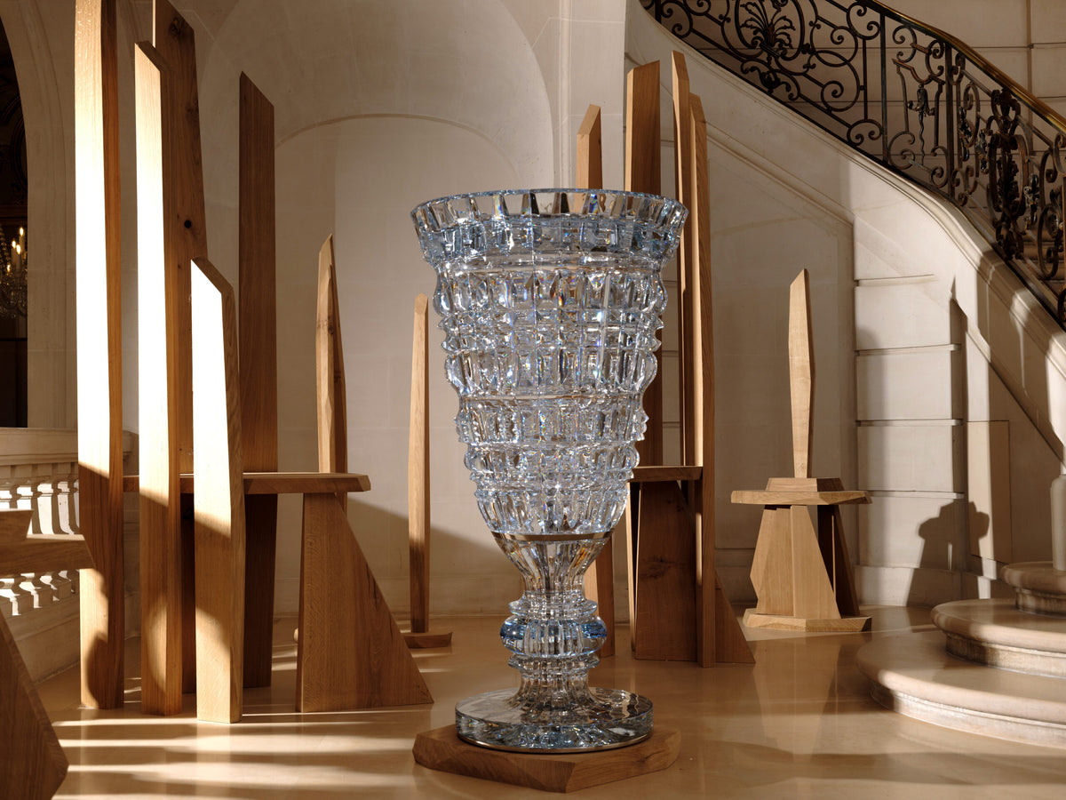 Monumental Baccarat cut-crystal vase in a grand stone hall
