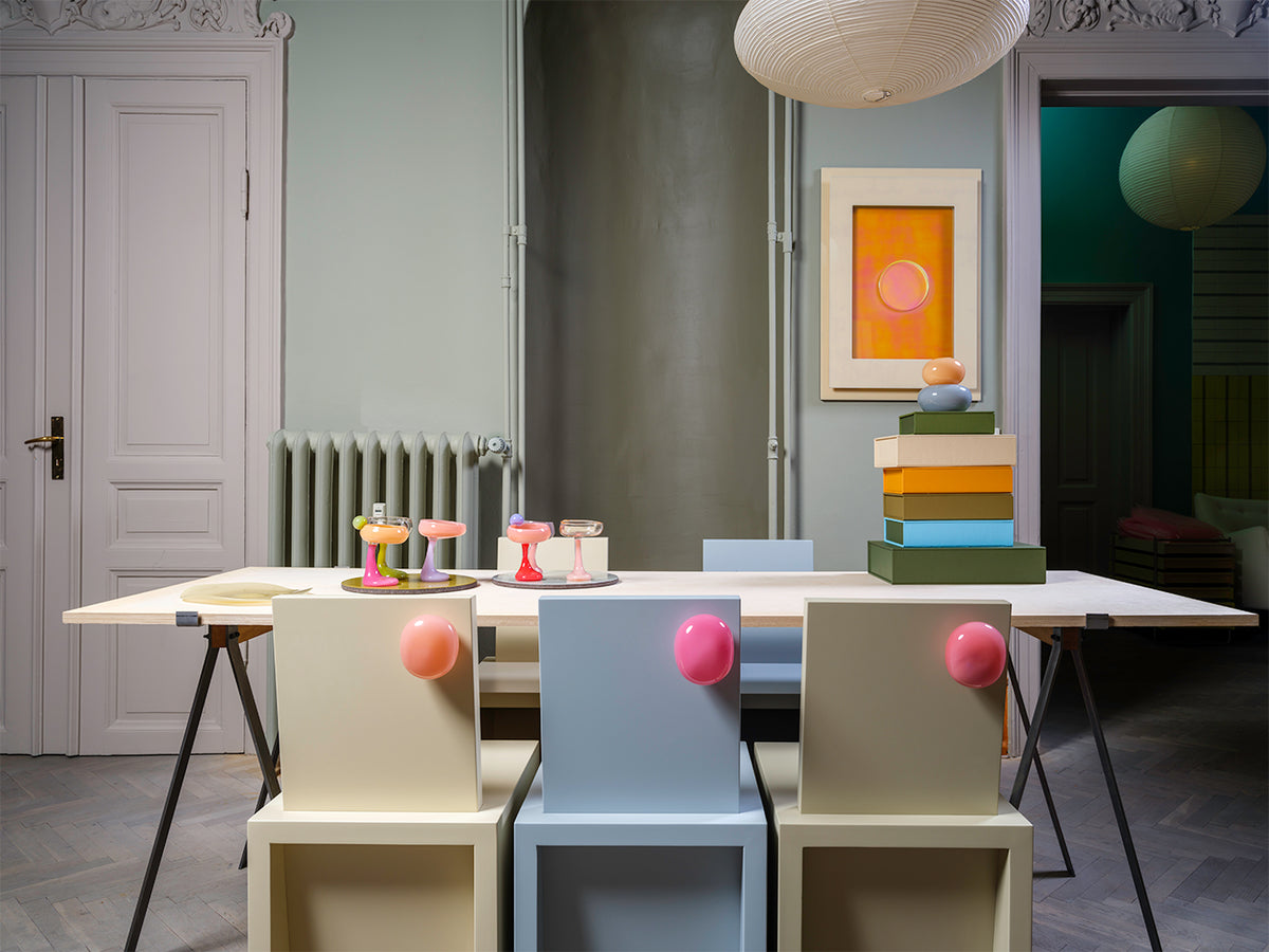 Colourful Helle Mardahl glass pieces on a dining table