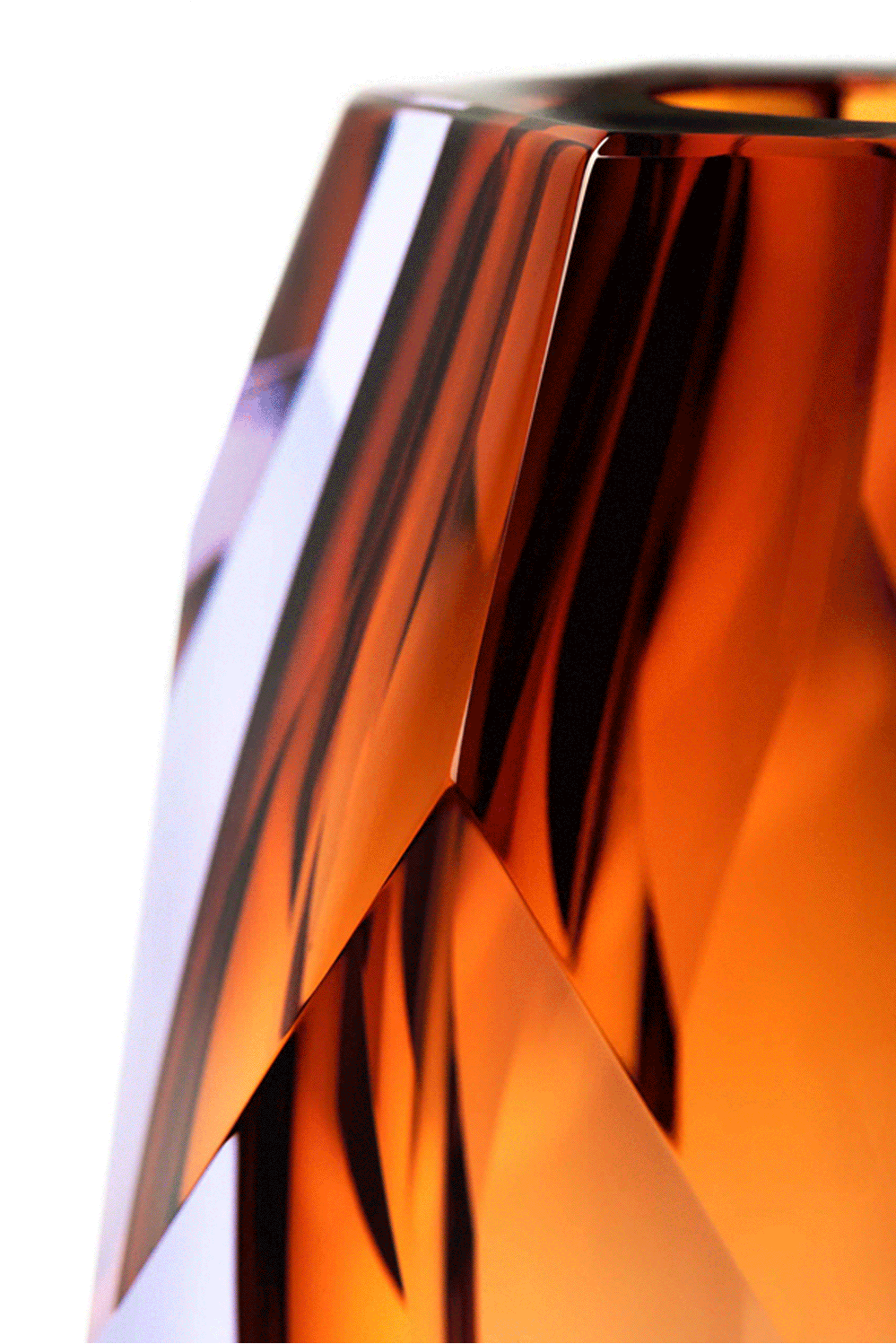 Close-up of a faceted amber Moser crystal vase