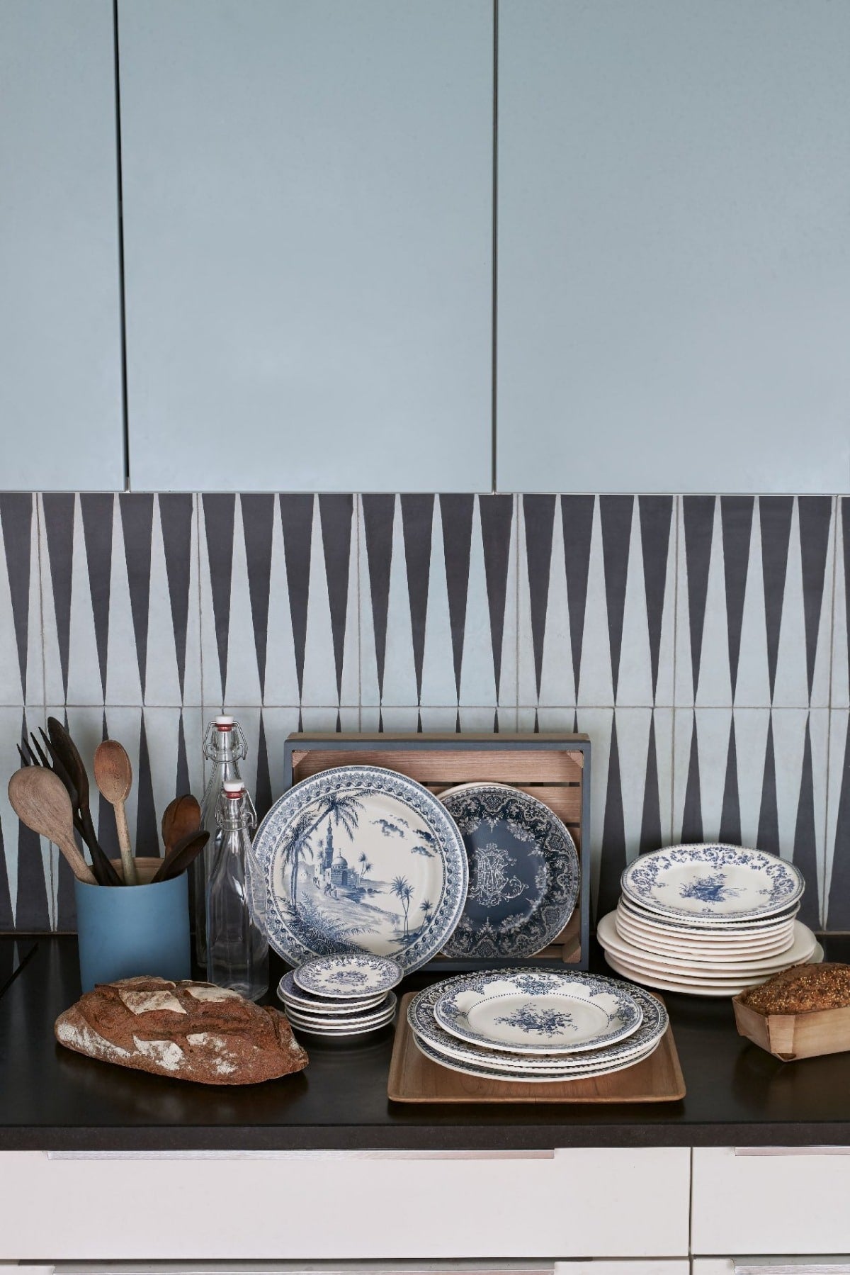 Gien blue and white faience plates on a kitchen counter