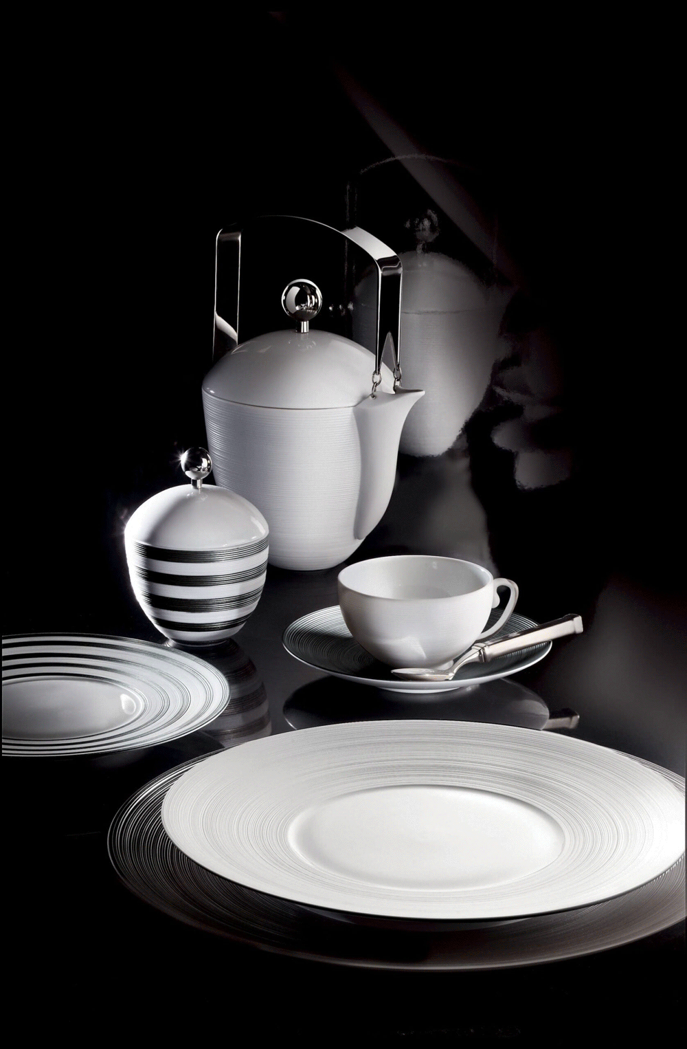 White J.L. Coquet porcelain teapot, cup and plates with a striped sugar bowl
