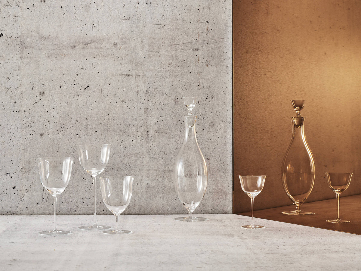 Lobmeyr wine glasses and decanters against a concrete wall