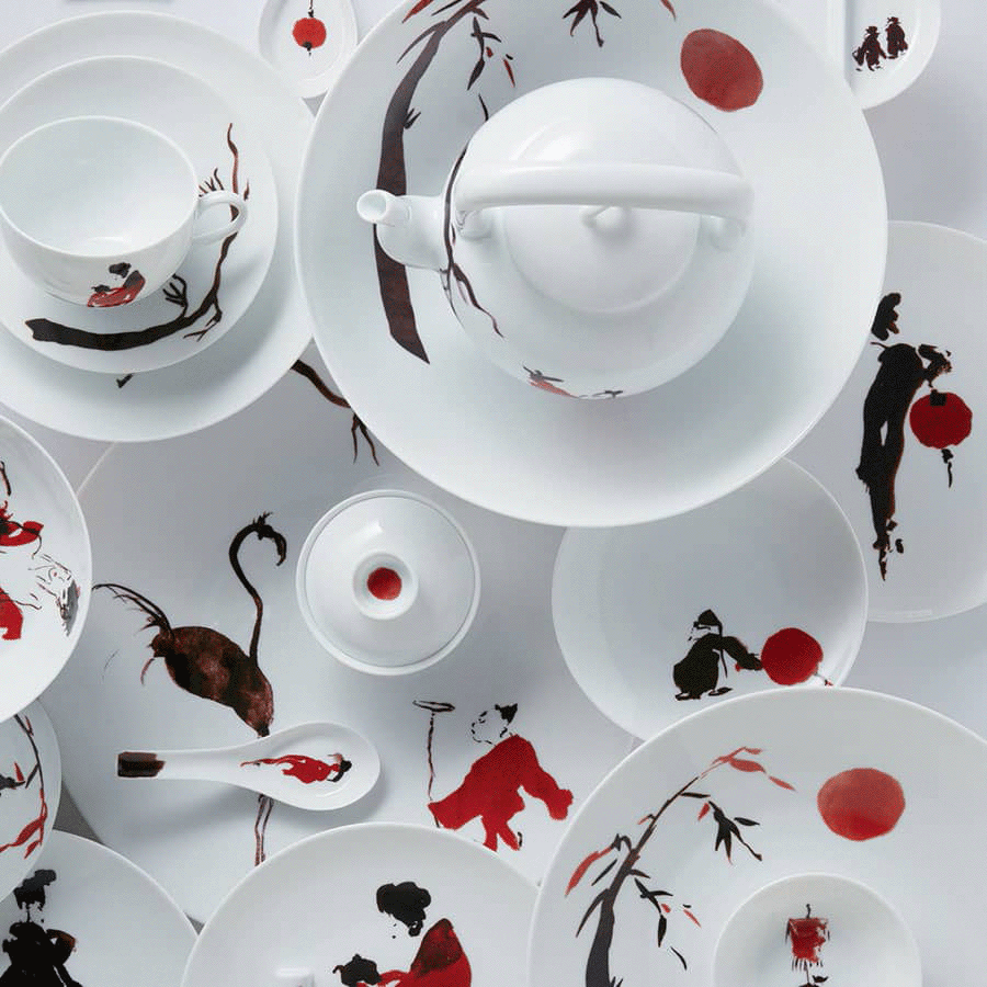 Raynaud porcelain dinnerware hand-painted with figures and red accents